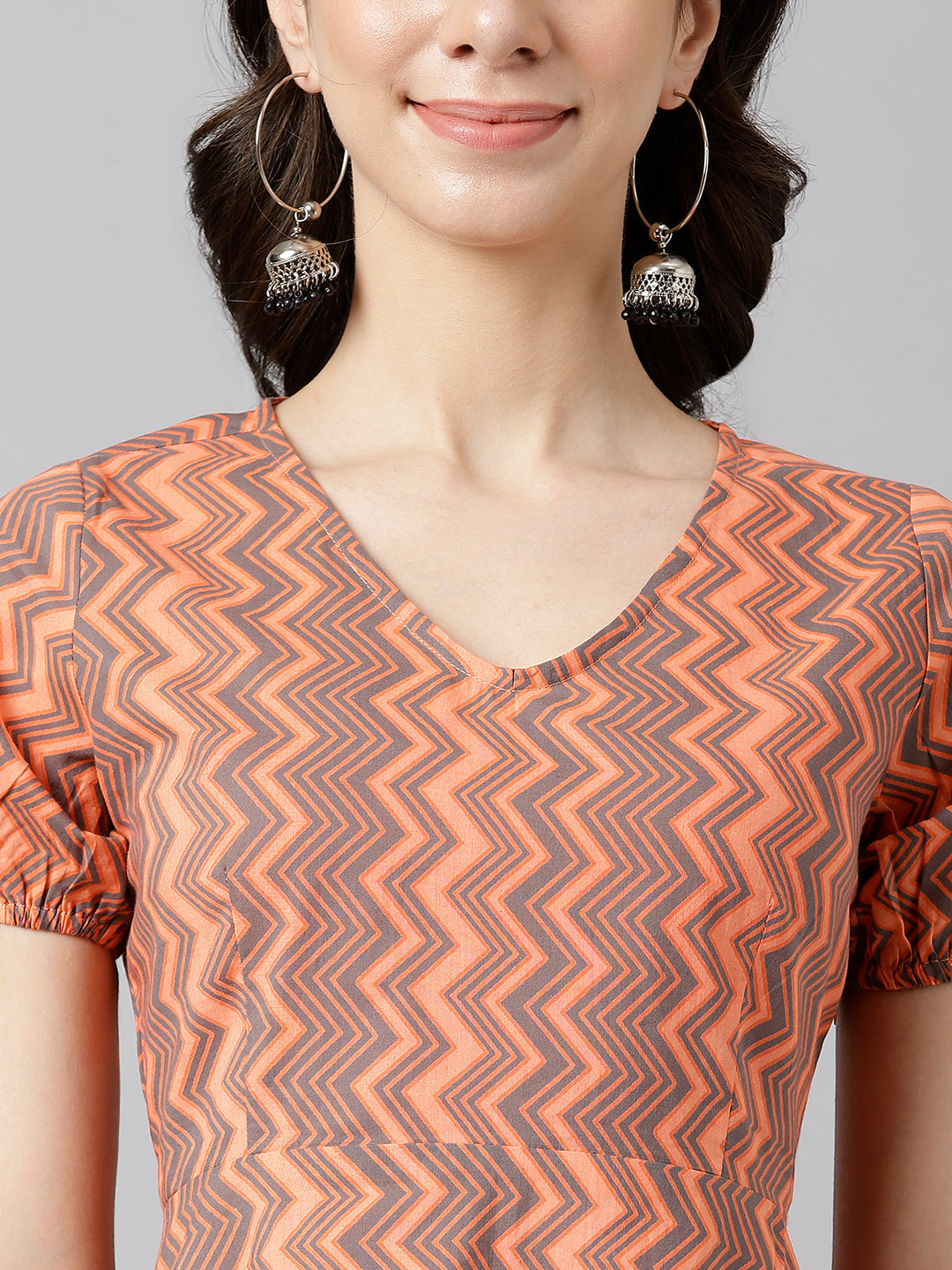 Peach Chevron V-Neck Printed Peplum Top